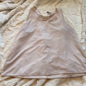 Beige blouse with adorable bow detail on back